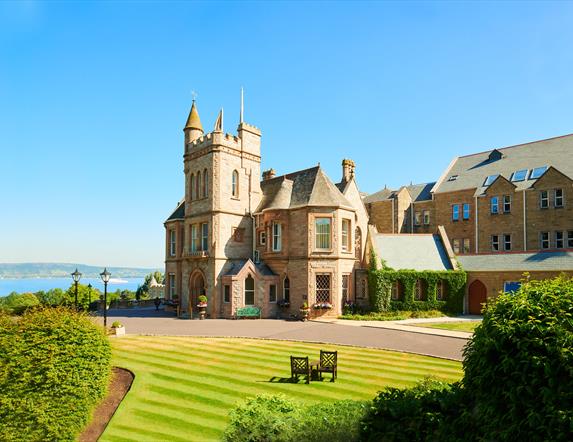 View of the hotel and landscaped grounds on a bright sunny day