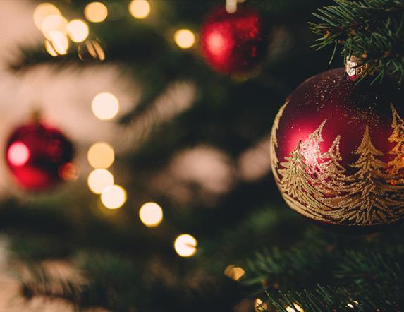 Christmas bauble hanging on Christmas Tree