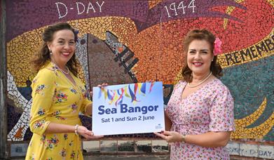 Members of music acts Soda Popz and the Leading Ladies Trio promote Sea Bangor on Eisenhower Pier