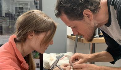 Man and Woman Making Wedding Rings Together