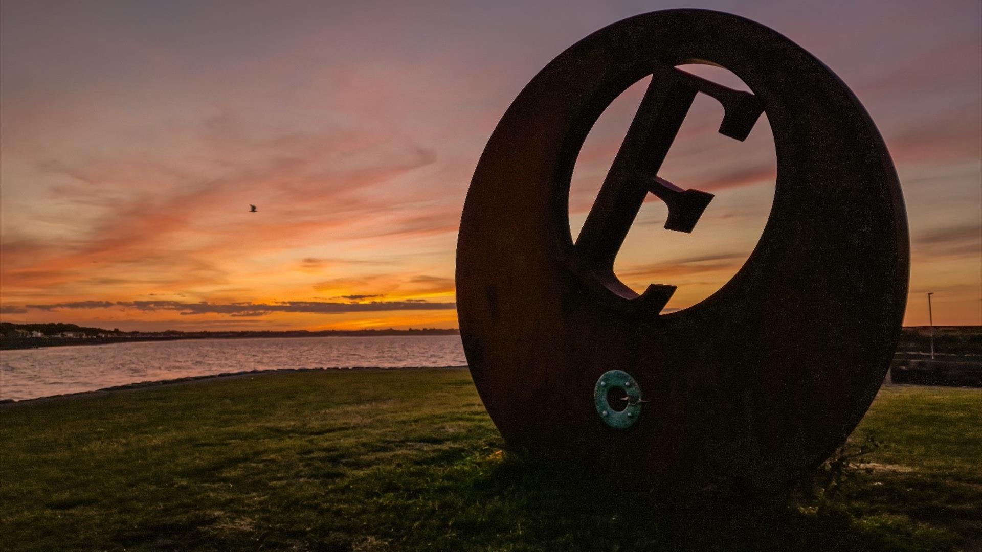 Sunset at Burr Point Ballyhalbert, E sculpture marking the most easterly point on the Island.