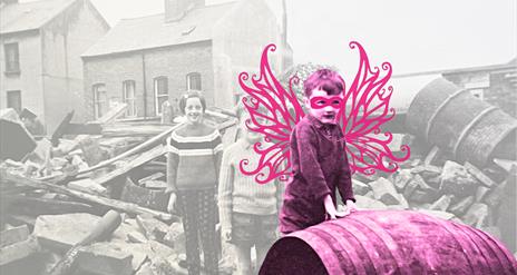 A young Richard O'Leary in 1970 standing amongst debris, edited to have  pink  fairy wings and a pink eye mask.
