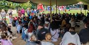 Attendees at HappyFest participating in a wellness panel discussion