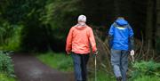 Two people set off for a walk through Cairn Wood Forest