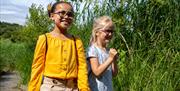 Two children exploring the wetlands.