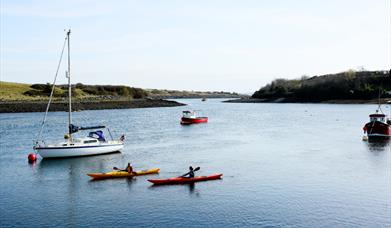 Kayakers and boats on Strangford Lough